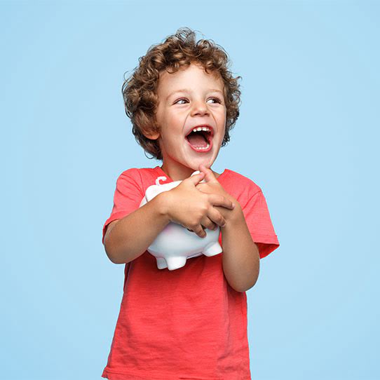 kid holding a piggy bank