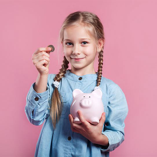 kid holding a piggy bank