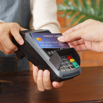 Man paying using his credit card