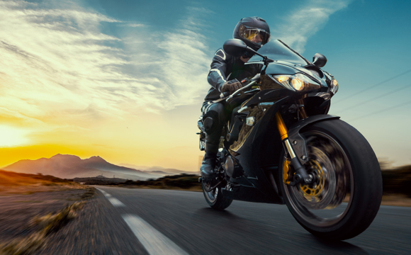 A close up of someone riding a motorcycle.