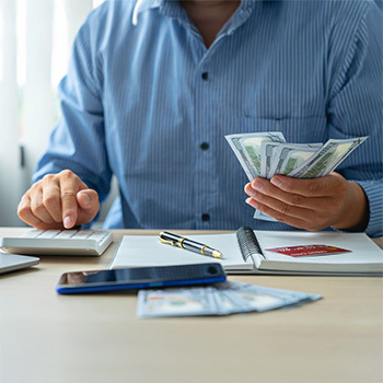 Stacks of coins with a plant on top
