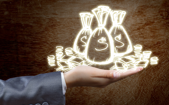A hand holding neon money bags and coins