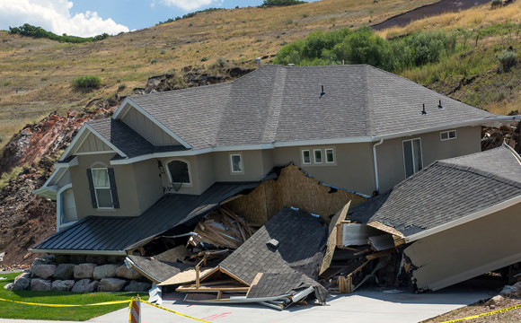 A home collapsing due to an earthquake.