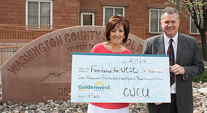 Goldenwest Business Development Manager Kelly Blake and Washington County School District Foundation Director Pam Graf display donation check